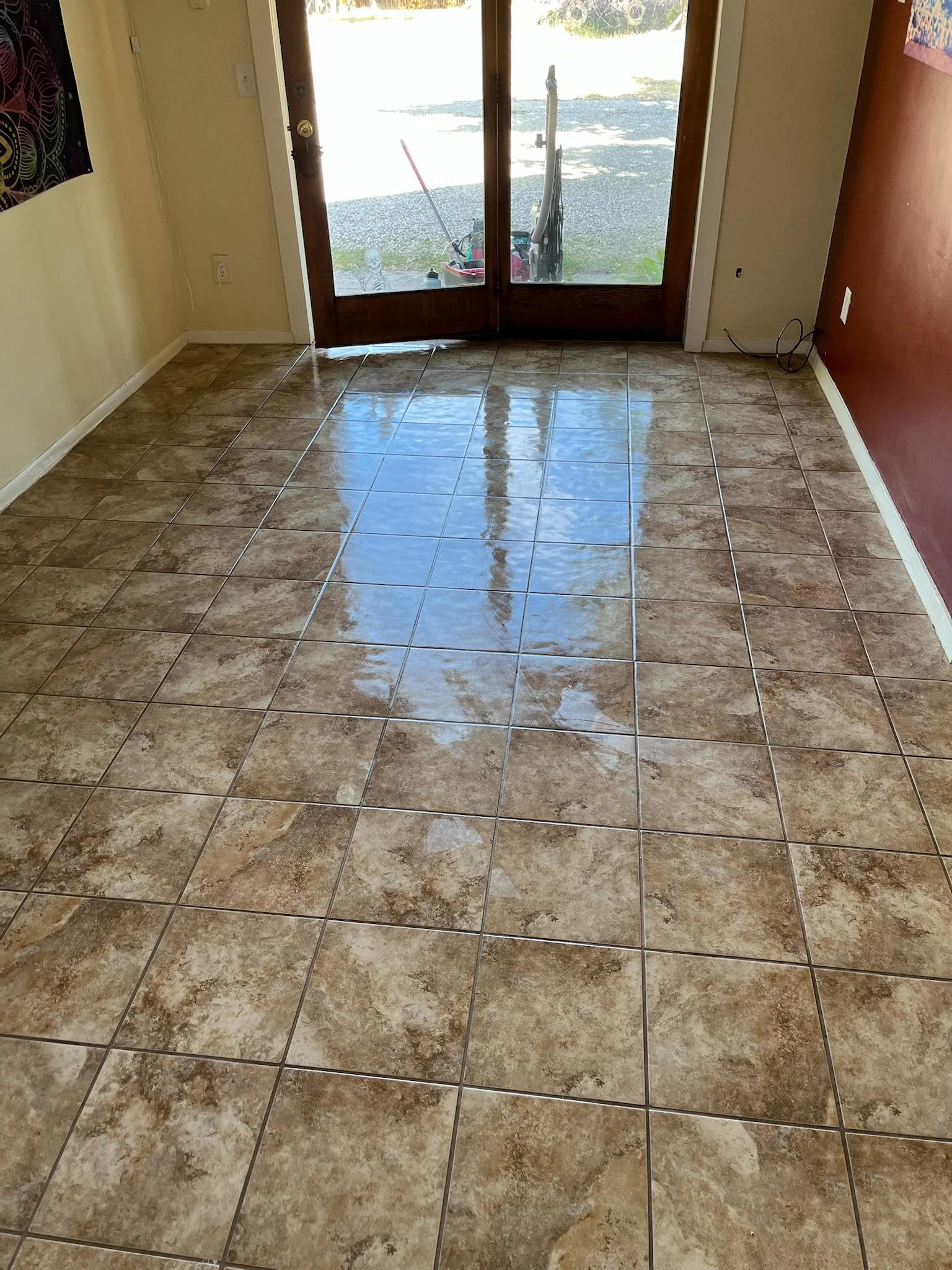 A freshly mopped tile entryway